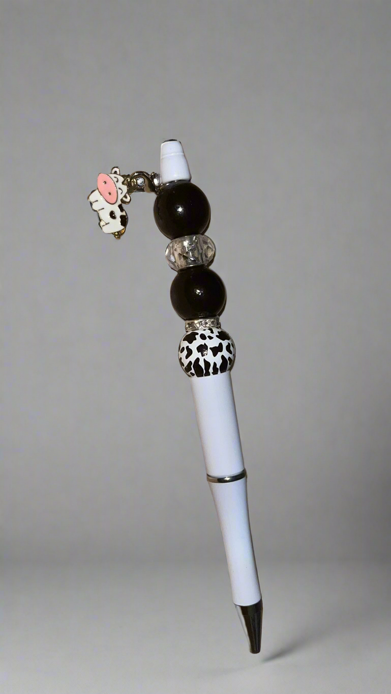 Beaded pen with hanging cow pendant