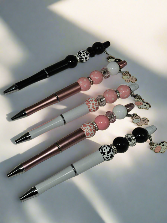 Beaded pen with hanging cow pendant