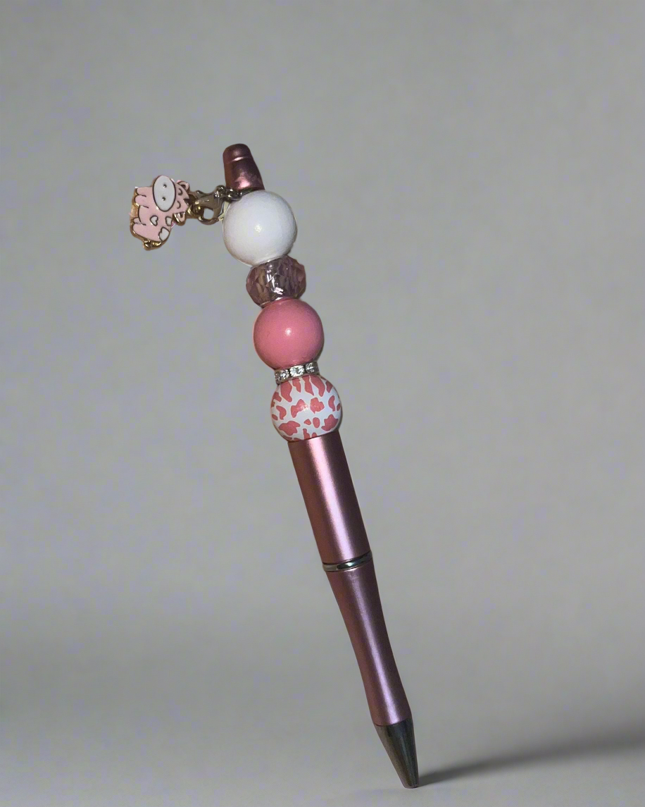 Beaded pen with hanging cow pendant